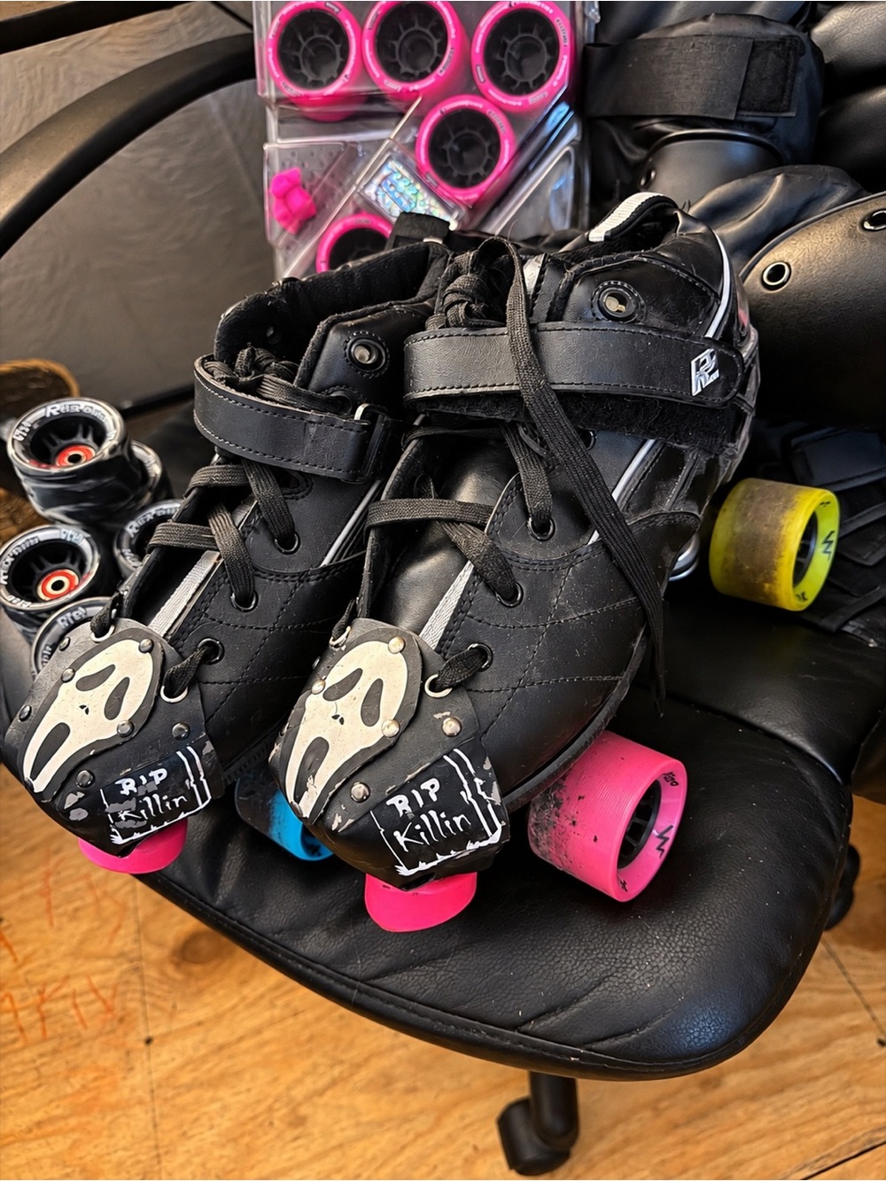 Rocks Black Quad Roller Skates with Pink and Blue Wheels